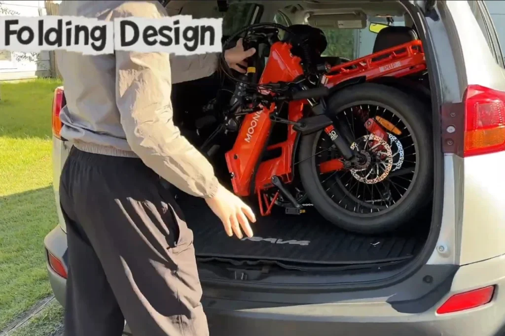 Mooncool POP folding electric bike in its folded position for compact storage and easy SUV transport